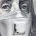 closeup of Benjamin Franklin's face on the $100 bill wearing medical mask