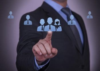 businessman selecting customers icon on virtual screen