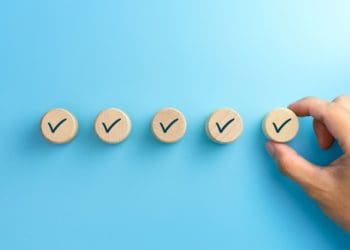 checklist concept, Check mark on wooden blocks, blue background