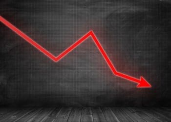 red downward-trending arrow on black background