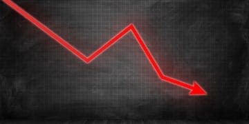 red downward-trending arrow on black background