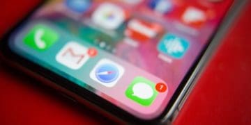 close-up of imessage app on smartphone on red background