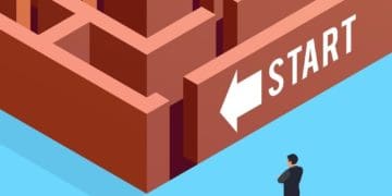 illustration of businessman standing in front of maze