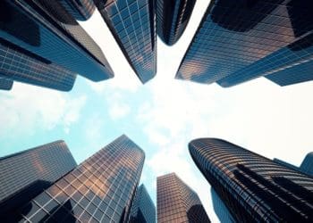 view of skyscrapers from the ground looking up