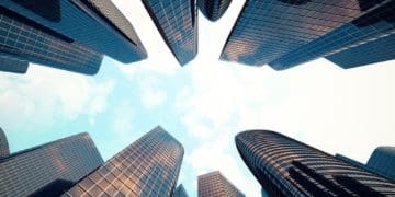 view of skyscrapers from the ground looking up
