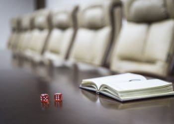 red dice on boardroom table