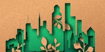 green city papercut on recycled paper background