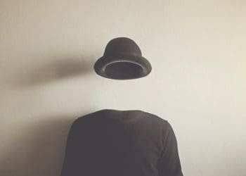 invisible man in black on neutral background