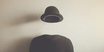 invisible man in black on neutral background