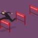 businessman jumping over hurdles with text challenge on them
