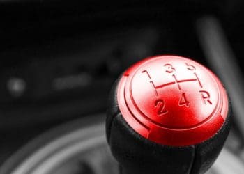 closeup of gear shift with red face