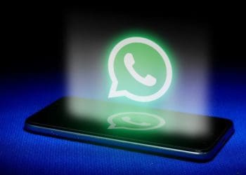 Hologram of whatsapp logo over smartphone