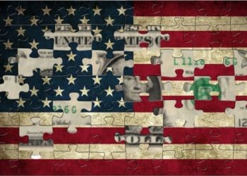 US flag puzzle with $1 bill showing behind missing pieces