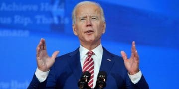 President Biden at podium on blue background