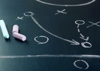 football game plan on chalkboard with chalk