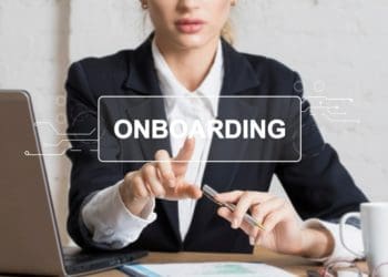 businesswoman presses virtual onboarding button