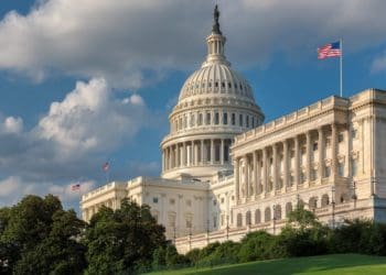 American flag flying outside U.S. capitol building