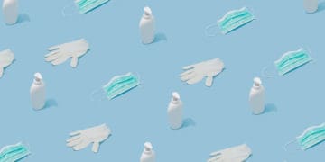 An illustration depicts masks, gloves, and hand sanitizer.