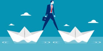 Illustration of a man standing on two paper boats in the ocean.