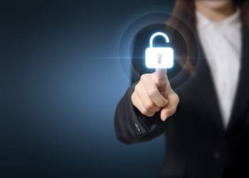 Businesswoman pressing unlocking on virtual screen