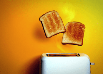 Toast pops out of a toaster.