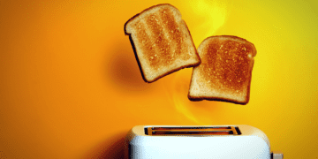 Toast pops out of a toaster.