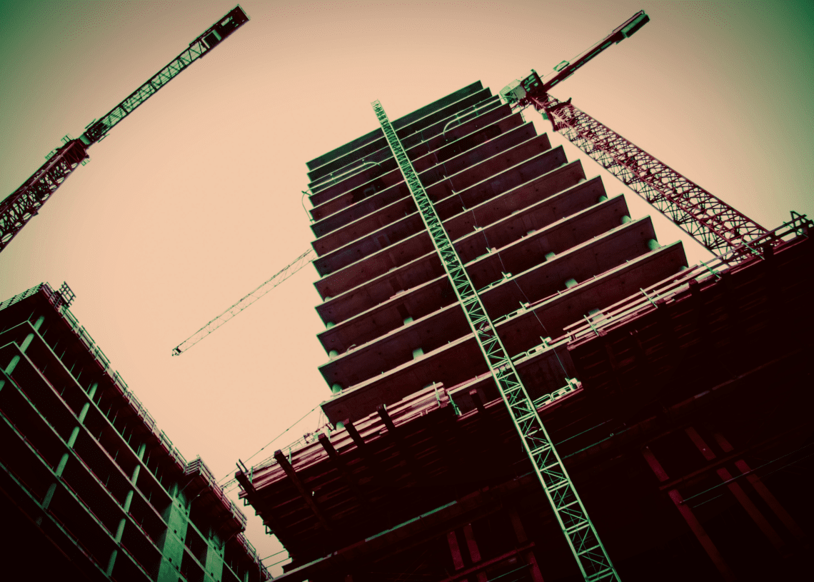 Ants eye view of a tall building under construction, a metaphor for security architecture.