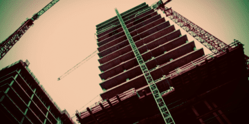 Ants eye view of a tall building under construction, a metaphor for security architecture.