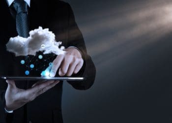 man on tablet with cloud