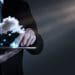 man on tablet with cloud