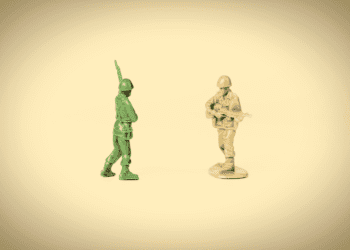 two toy soldiers face off.