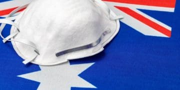 closeup of N-95 mask on Australian flag