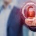 man touching virtual screen with red padlock, concept of cyber risk