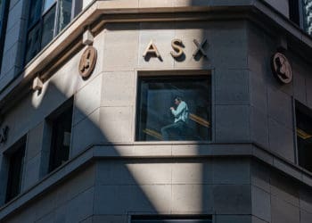 A man is seen talking in the window of the Australia Securities Exchange in Sydney.