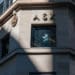 A man is seen talking in the window of the Australia Securities Exchange in Sydney.