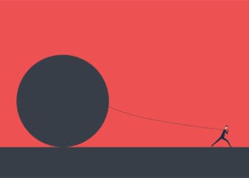 A stick figure pulls an oversized ball across flat ground.