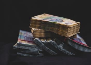 dark image of stacks of bills