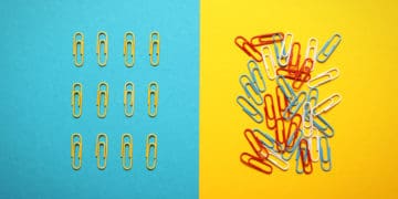 Piles of paper clips illustrate concepts of order and chaos.