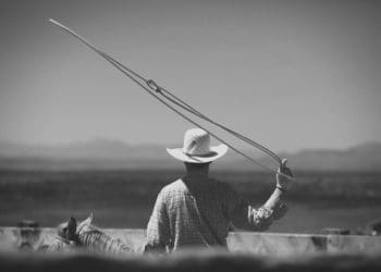 A cowboy swings a lasso