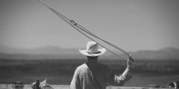 A cowboy swings a lasso