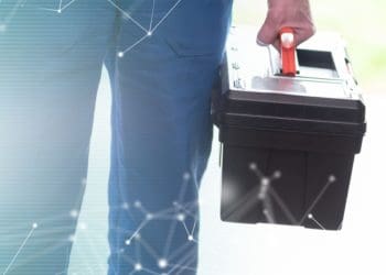 repairman standing with toolbox