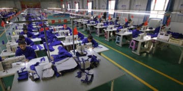 Uyghur women work at a textile factory in Xinjiang
