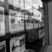 real estate listings sit in a store front window.