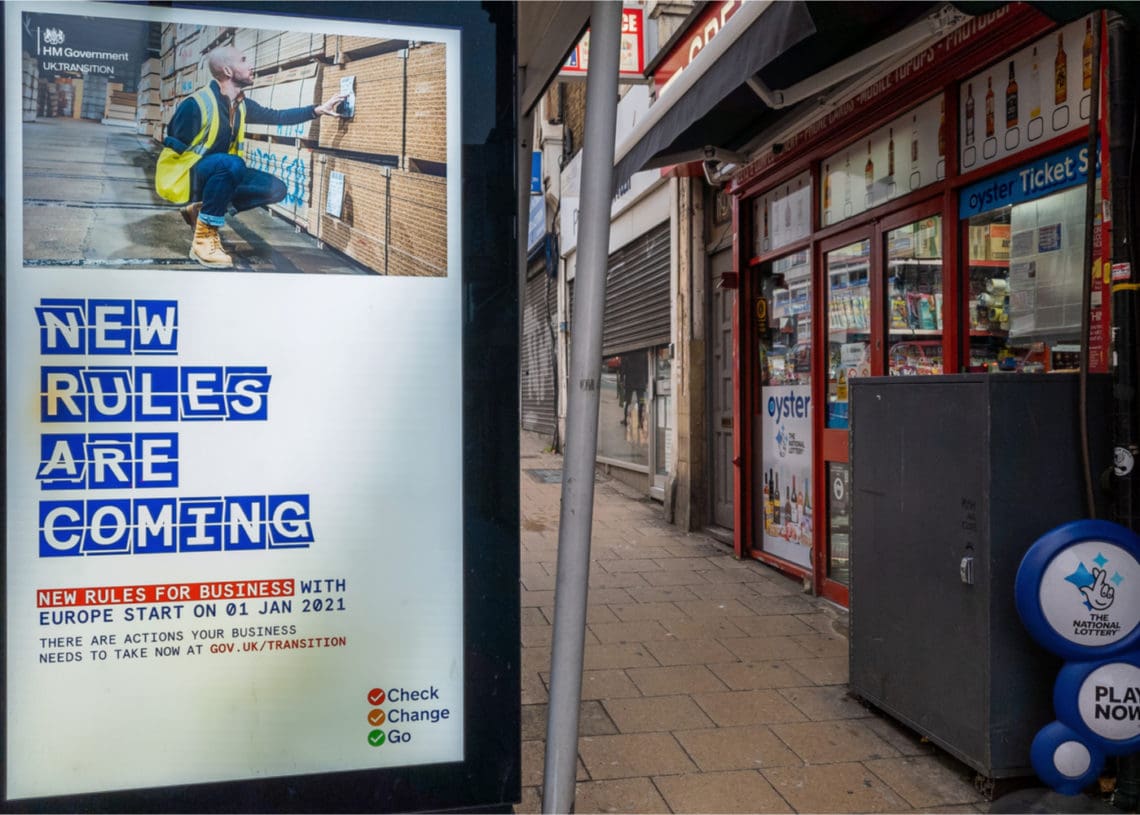 A billboard annoucning new rules for businesses post brexit in london.