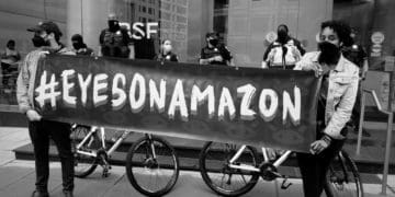 Demonstrators protest outside amazon investment firm