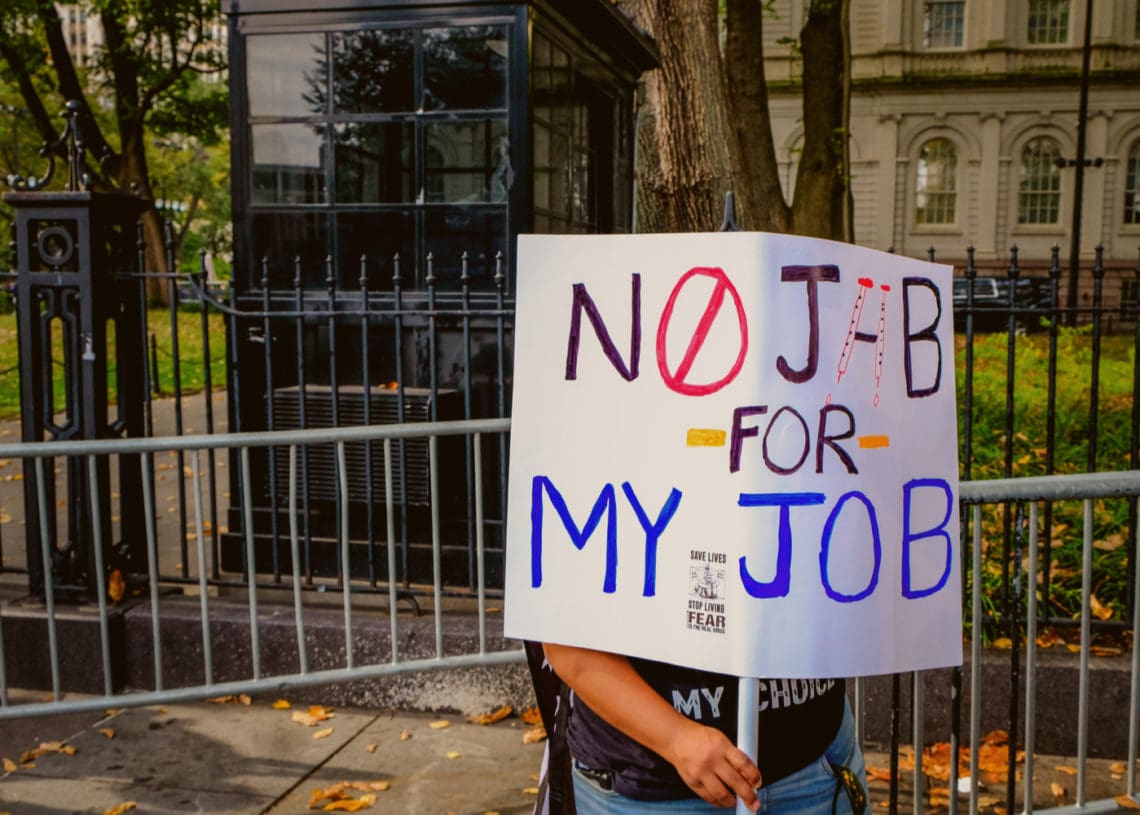An unidentified New Yorker protests vaccine mandates at work.