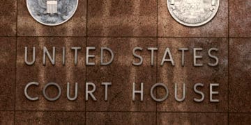 Building facade reads United States Court House - District Court in Texas .