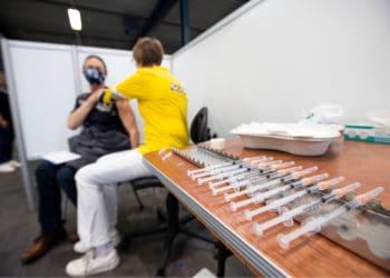 A person receives a covid vaccine.