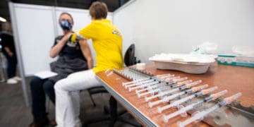 A person receives a covid vaccine.