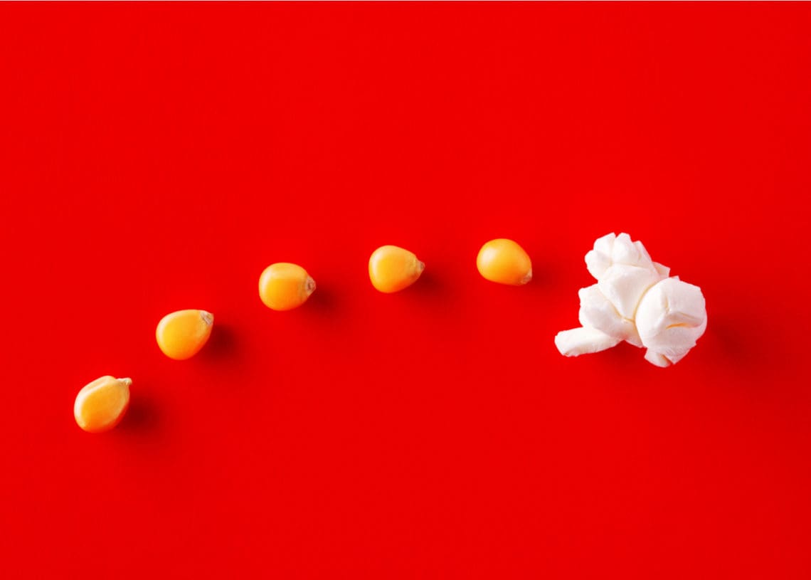 popcorn kernels begin to pop